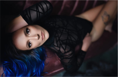 fantastic woman with black and blue hair in classy black lingerie